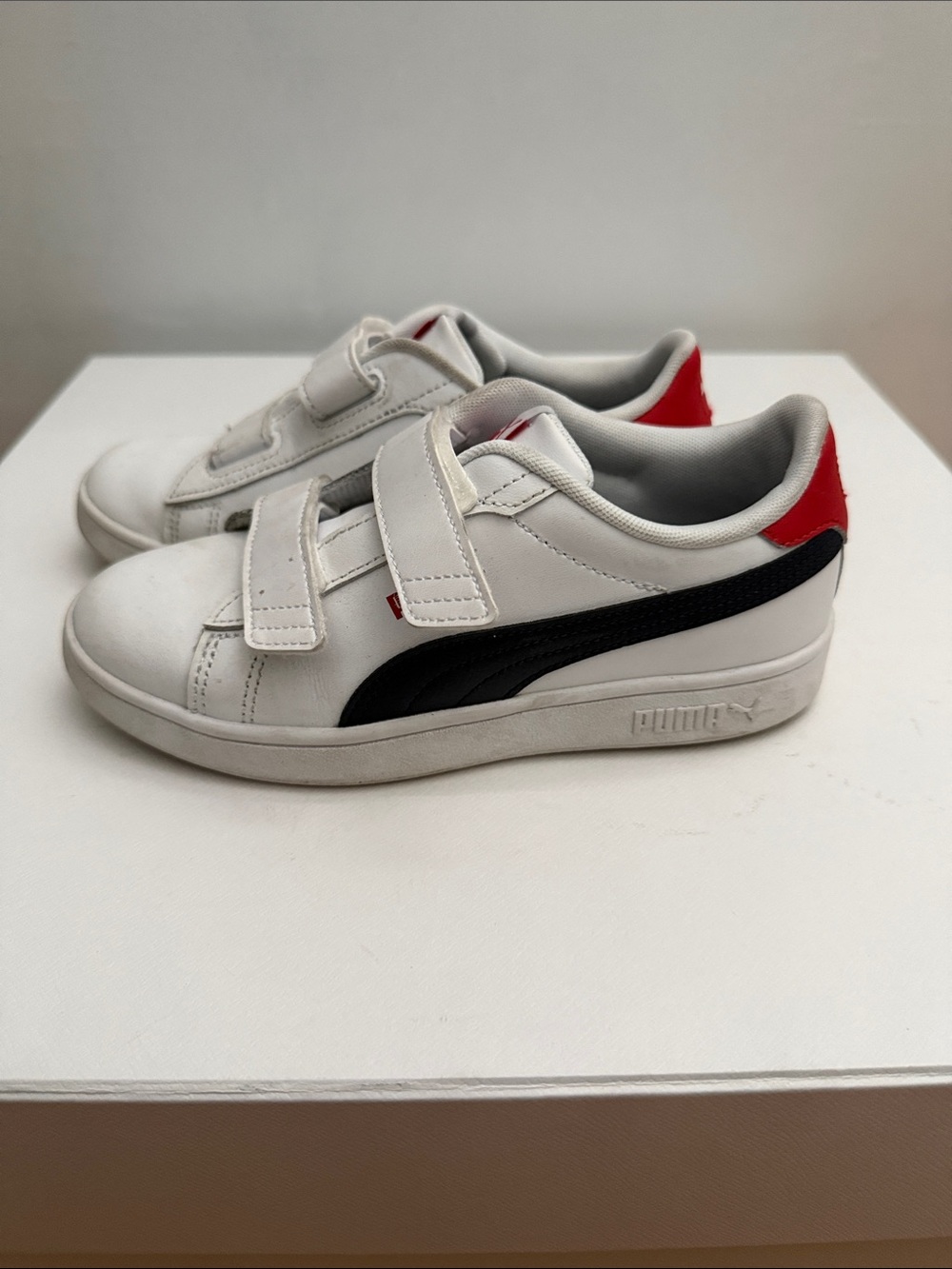 PUMA Kids White Sneakers with Black Side Stripe and Red Heel